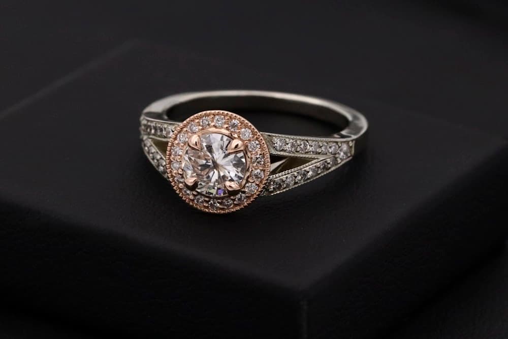 Diamond engagement ring on dark surface